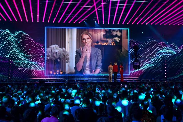 A giant screen shows Canadian singer Celine Dion giving a recorded message during the dress rehearsal for the final of the Eurovision Song Contest 2025 at the St. Jakobshalle arena in Basel on May 16, 2025. Dion was 20 and little-known outside her native French-speaking Quebec province in Canada when she won Eurovision in 1988, guesting for Switzerland, with the song "Ne Partez Pas Sans Moi". (Photo by Fabrice COFFRINI / AFP)