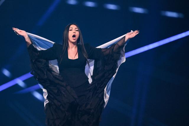 Israeli singer Yuval Raphael representing Israel with the song "New Day Will Rise" parades with her national flag during the dress rehearsal for the final of the Eurovision Song Contest 2025 at the St. Jakobshalle arena in Basel on May 16, 2025. (Photo by Fabrice COFFRINI / AFP)