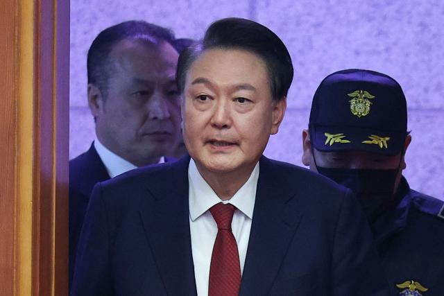 (FILES) South Korea’s impeached President Yoon Suk Yeol arrives for his impeachment trial at the Constitutional Court in Seoul on January 21, 2025. South Korea's impeached ex-president Yoon Suk Yeol said May 17, 2025 he is leaving his conservative party ahead of snap elections triggered by his ouster last month over a disastrous bid to impose martial law. (Photo by Kim Hong-Ji / POOL / AFP)