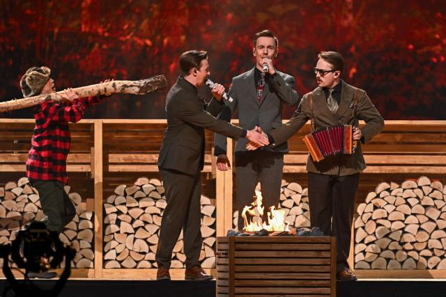 Finnishg group Kaj, representing Sweden with the song "Bara Bada Bastu”, performs during the dress rehearsal for the final of the Eurovision Song Contest 2025 at the St. Jakobshalle arena in Basel on May 16, 2025.  (Photo by Fabrice COFFRINI / AFP)