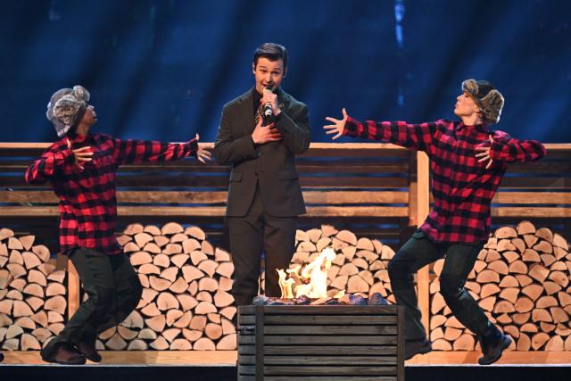 Finnishg group Kaj, representing Sweden with the song "Bara Bada Bastu”, performs during the dress rehearsal for the final of the Eurovision Song Contest 2025 at the St. Jakobshalle arena in Basel on May 16, 2025.  (Photo by Fabrice COFFRINI / AFP)
