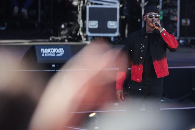 (FILES) Werenoi performs on stage during the 40th edition of the Francofolies de La Rochelle music festival, in La Rochelle, southwestern France, on July 13, 2024. French hip-hop artist Werenoi, France's number one album seller in 2023 and 2024, has died at the age of 31, his producer announced on social network X on May 17, 2025. (Photo by Thibaud MORITZ / AFP)