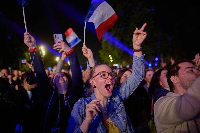 Fans of the singer representing France gather at a fan zone on Place de la Bastille to watch a broadcast of the grand final of the Eurovision Song Contest 2025, which takes place in Basel, Switzerland, in Paris on May 17, 2025. (Photo by Kiran RIDLEY / AFP)