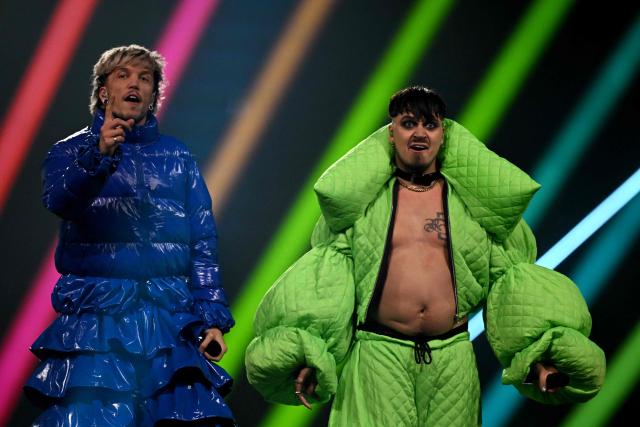 Croatian singer Baby Lasagna (L) and Finnish singer Käärijä perform during the grand final of the Eurovision Song Contest 2025, at the St. Jakobshalle arena in Basel on May 17, 2025. (Photo by Fabrice COFFRINI / AFP)