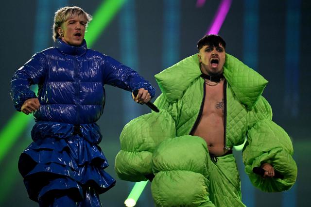 Croatian singer Baby Lasagna (L) and Finnish singer Käärijä perform during the grand final of the Eurovision Song Contest 2025, at the St. Jakobshalle arena in Basel on May 17, 2025. (Photo by Fabrice COFFRINI / AFP)