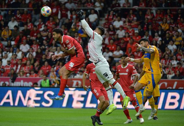 Toluca's goalkeeper #22 Luis Garcia clears the ball during the Liga MX Clausura tournament semi-final second leg football match between Toluca and Tigres at the Nemesio Diez Stadium in Toluca, Mexico on May 17, 2025. (Photo by Mario Vazquez / AFP)