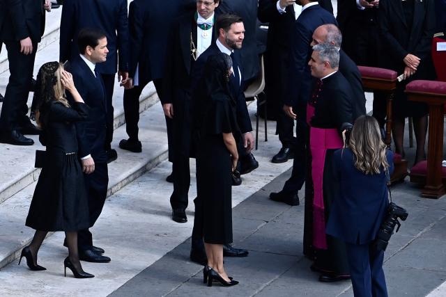 JD US Vice President JD Vance (C, R) and his wife Usha (C, L), US Secretary of State Marco Rubio (2ndL) and his wife Jeanette arrive to attend a Holy Mass for the Beginning of the Pontificate of Pope Leo XIV, in St Peter's square in The Vatican on May 18, 2025. (Photo by Isabella BONOTTO / AFP)
