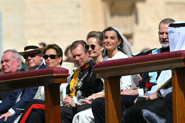 Spain's King Felipe VI (2R), Sheikh Saud bin Saqr al Qasimi (R) and Spain's Queen Letizia (3R) wait ahead a Holy Mass for the Beginning of the Pontificate of Pope Leo XIV, in St Peter's square in The Vatican on May 18, 2025. (Photo by Alberto PIZZOLI / AFP)