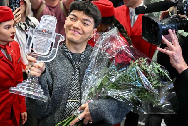 Austrian singer Johannes Pietsch aka JJ, winner of the 2025 Eurovision Song Contest, reacts as he arrives at Vienna International Airport in Schwechat, Austria on May 18, 2025. Austria's JJ won the 2025 Eurovision Song Contest on May 17 in Basel, with his operatic song "Wasted Love" triumphing at the world's biggest live music television event. (Photo by Joe Klamar / AFP) / ALTERNATIVE CROP