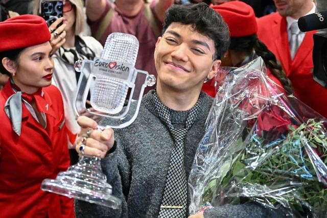 Austrian singer Johannes Pietsch aka JJ, winner of the 2025 Eurovision Song Contest, reacts as he arrives at Vienna International Airport in Schwechat, Austria on May 18, 2025. Austria's JJ won the 2025 Eurovision Song Contest on May 17 in Basel, with his operatic song "Wasted Love" triumphing at the world's biggest live music television event. (Photo by Joe Klamar / AFP) / ALTERNATIVE CROP
