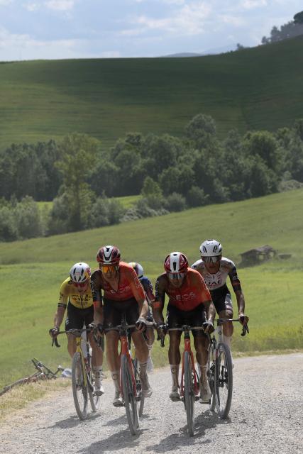 (LtoR)  Team Visma-Lease a Bike's Belgian rider Wout Van Aert, Ineos Grenadiers' Dutch rider Thymen Arensman, Ineos Grenadiers' Colombian rider Egan Bernal, Ineos Grenadiers' Brandon Rivera and UAE Team Emirates XRG's Mexican rider Isaac Del Toro ride on a gravel section during the 9th stage of the 108th Giro d'Italia cycling race in San Martino in Grania near Siena, on May 18, 2025. (Photo by Luca Bettini / POOL / AFP)