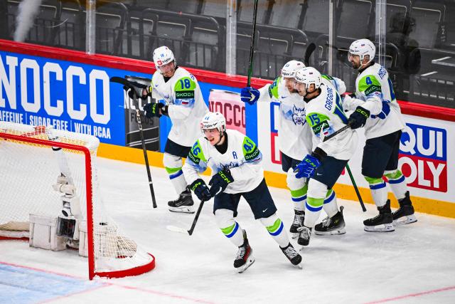 Slovenia’s defender #46 Matic Torok celebrates with his teammates after scoring 1-3 during the IIHF Men's Ice hockey World Championship match between France and Slovenia in Stockholm, on May 19, 2025. (Photo by Jonathan NACKSTRAND / AFP)