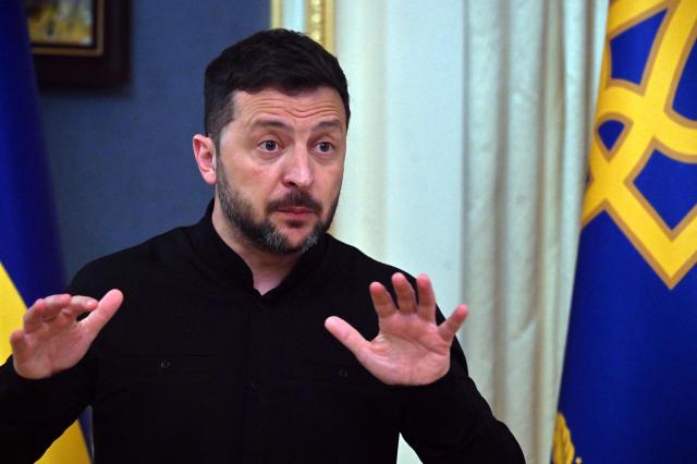 Ukraine's President Volodymyr Zelensky speaks to the media during a press briefing after his phone talks with the US president, in Kyiv, on May 19, 2025, amid the Russian invasion on Ukraine. The United States has agreed to "tightly coordinate" Ukraine talks with European partners following a call between US President Donald Trump and his Russian counterpart Vladimir Putin, the German government said on May 19. Immediately after his conversation with Putin, Trump held a second call with Ukrainian President Volodymyr Zelensky, and the leaders of France, Finland, Germany, and the EU Commission. (Photo by Sergei SUPINSKY / AFP)