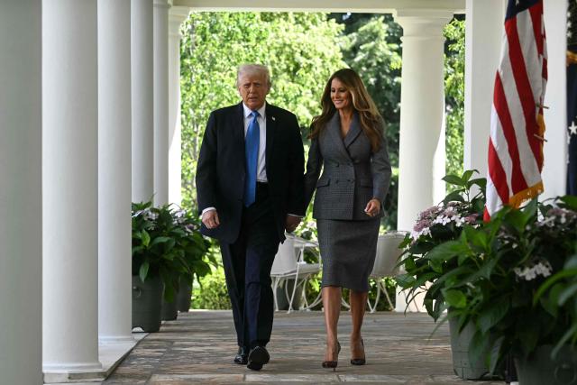 (L-R) US President Donald Trump and First Lady Melania Trump arrive for a bill signing ceremony for the "Take It Down Act" in the Rose Garden of the White House in Washington, DC, on May 19, 2025. The bipartisan legislation will criminalize the non-consenual publication of  sexual imagery, including AI-generated deepfakes and "revenge porn." (Photo by Jim WATSON / AFP)