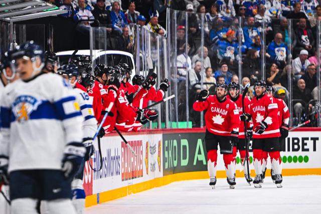 Canada’s forward #90 Ryan O’Reilly celebrates with his teammates after scoring 1-0 during the IIHF Men's Ice hockey World Championship match between Canada and Finland in Stockholm, on May 19, 2025. (Photo by Jonathan NACKSTRAND / AFP)