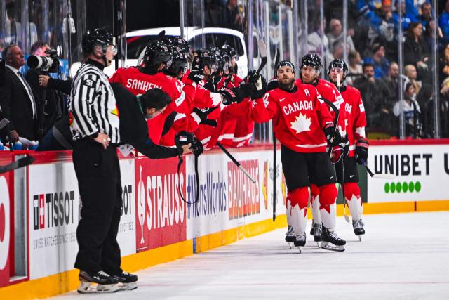 Canada’s forward #90 Ryan O’Reilly celebrates with his teammates after scoring 1-0 during the IIHF Men's Ice hockey World Championship match between Canada and Finland in Stockholm, on May 19, 2025. (Photo by Jonathan NACKSTRAND / AFP)