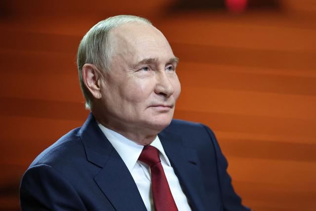In this pool photograph distributed by the Russian state agency Sputnik, Russian President Vladimir Putin looks on as he meets with students at the Sirius Educational Center in Sochi on May 19, 2025, after a telephone conversation with US President Donald Trump. (Photo by Alexander KAZAKOV / POOL / AFP)