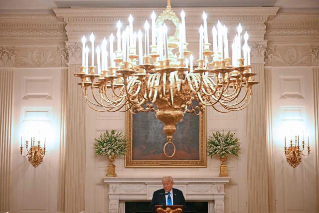 US President Donald Trump speaks during a Kennedy Center Board dinner in the State Dining Room of the White House in Washington, DC, on May 19, 2025. (Photo by Jim WATSON / AFP)