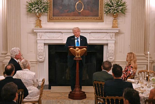 US President Donald Trump speaks during a Kennedy Center Board dinner in the State Dining Room of the White House in Washington, DC, on May 19, 2025. (Photo by Jim WATSON / AFP)