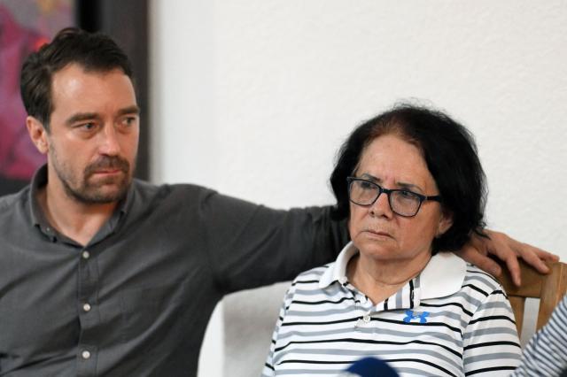 Eleonora Alfaro (R), mother of lawyer Ruth Lopez of the human rights group Cristosal, looks on next to Noah Bullock, executive director of Cristosal, during a press conference to report on the arrest of her daughter by Salvadoran police in Santa Tecla, El Salvador, on May 19, 2025. The Salvadoran lawyer who denounced corruption in Nayib Bukele's government and assisted the 252 Venezuelan migrants deported by the United States and imprisoned in El Salvador was arrested, reported Monday the human rights group Cristosal, where she works. (Photo by Marvin RECINOS / AFP)