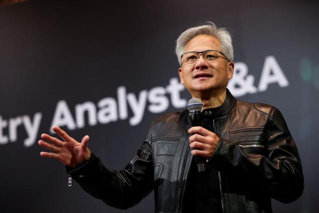 Jensen Huang, co-founder and CEO of Nvidia Corp., speaks during a news conference in Taipei on May 21, 2025. Huang said that US export controls on artificial intelligence chips to China had failed, with companies using locally developed technology. (Photo by I-Hwa Cheng / AFP)
