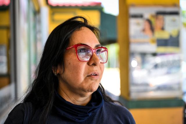 Keyla Mendez looks on as she speaks during an AFP interview outside a Venzuelan food mart in Doral, Florida, May 20, 2025. Denis Caldeira feels in a legal “limbo” since, a few hours ago on May 20, 2025 the US Supreme Court authorized Donald Trump's administration to revoke the immigration status that protected him and nearly 350,000 other Venezuelan migrants. Caldeira, 47, is a beneficiary of Temporary Protected Status (TPS), which covers hundreds of thousands of Venezuelans and was largely granted by former Democratic President Joe Biden, who considered the government of Nicolбs Maduro authoritarian. (Photo by CHANDAN KHANNA / AFP)