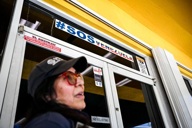 Keyla Mendez looks on as she speaks during an AFP interview outside a Venzuelan food mart in Doral, Florida, May 20, 2025. Denis Caldeira feels in a legal “limbo” since, a few hours ago on May 20, 2025 the US Supreme Court authorized Donald Trump's administration to revoke the immigration status that protected him and nearly 350,000 other Venezuelan migrants. Caldeira, 47, is a beneficiary of Temporary Protected Status (TPS), which covers hundreds of thousands of Venezuelans and was largely granted by former Democratic President Joe Biden, who considered the government of Nicolбs Maduro authoritarian. (Photo by CHANDAN KHANNA / AFP)