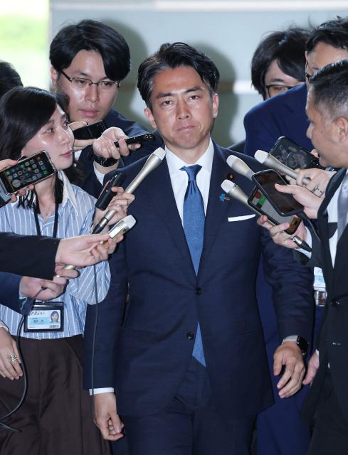Japan's former environment minister Shinjiro Koizumi, who was appointed as the country's new farm minister, arrives at the prime minister's office in Tokyo on May 21, 2025. Japan's farm minister Taku Eto resigned on May 21, after a gaffe about rice that drew public fury in a country experiencing soaring prices of the cherished staple. As the successor to Eto, Prime Minister Shigeru Ishiba named Shinjiro Koizumi, a media-savvy former environment minister and son of popular former premier Junichiro Koizumi. (Photo by JIJI Press / AFP) / Japan OUT