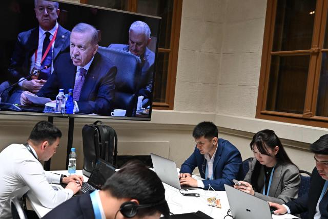 A screen at the press center shows Turkish President Recep Tayyip Erdogan during the informal summit of the Organization of Turkic States on May 21, 2025 at the Varkert Bazar cultural center in Budapest. (Photo by Attila KISBENEDEK / AFP)