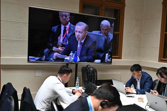 A screen at the press center shows Turkish President Recep Tayyip Erdogan during the informal summit of the Organization of Turkic States on May 21, 2025 at the Varkert Bazar cultural center in Budapest. (Photo by Attila KISBENEDEK / AFP)