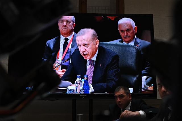 A screen at the press center shows Turkish President Recep Tayyip Erdogan during the informal summit of the Organization of Turkic States on May 21, 2025 at the Varkert Bazar cultural center in Budapest. (Photo by Attila KISBENEDEK / AFP)