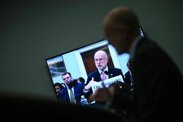 Chairman of the Federal Communications Commission (FCC) Brendan Carr is seen in a television screen as he testifies before the House Subcommittee on Financial Services and General Government on oversight of the FCC, on Capitol Hill in Washington, DC on May 21, 2025. (Photo by Brendan SMIALOWSKI / AFP)