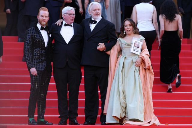 (From 2L) Australian publisher, activist Julian Assange and his wife Swedish-Spanish lawyer Stella Assang arrive for the screening of the film "The Six Billion Dollar Man" at the 78th edition of the Cannes Film Festival in Cannes, southern France, on May 21, 2025. (Photo by Sameer AL-DOUMY / AFP)