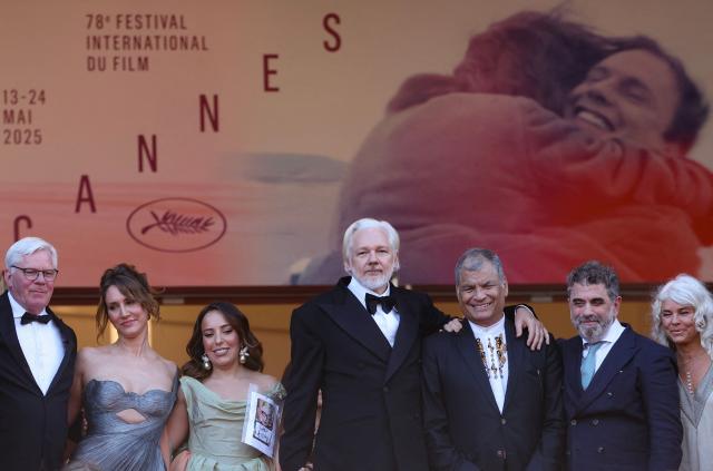 (From 2L) British-French producer Kathleen Fournier, Swedish-Spanish lawyer Stella Assange, Australian publisher, activist Julian Assange, former Ecuador president Rafael Correa arrive for the screening of the film "The Six Billion Dollar Man" at the 78th edition of the Cannes Film Festival in Cannes, southern France, on May 21, 2025. (Photo by Sameer AL-DOUMY / AFP)