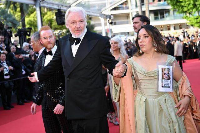 Australian publisher, activist Julian Assange and his wife Swedish-Spanish lawyer Stella Assange arrive for the screening of the film "The Six Billion Dollar Man" at the 78th edition of the Cannes Film Festival in Cannes, southern France, on May 21, 2025. (Photo by Bertrand GUAY / AFP)