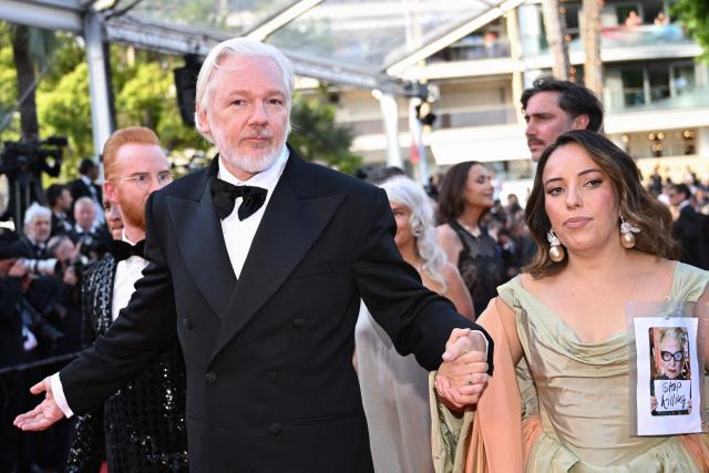 Australian publisher, activist Julian Assange and his wife Swedish-Spanish lawyer Stella Assange arrive for the screening of the film "The Six Billion Dollar Man" at the 78th edition of the Cannes Film Festival in Cannes, southern France, on May 21, 2025. (Photo by Bertrand GUAY / AFP)