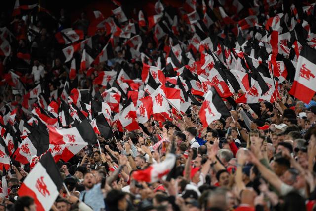 Manchester United fans cheer before the UEFA Europa League final football match between Tottenham Hotspur and Manchester United at San Mames stadium in Bilbao on May 21, 2025. (Photo by Josep LAGO / AFP)