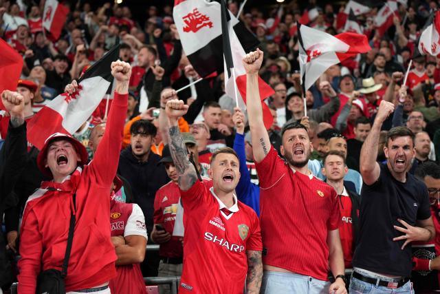 Manchester United fans cheer before the UEFA Europa League final football match between Tottenham Hotspur and Manchester United at San Mames stadium in Bilbao on May 21, 2025. (Photo by Cesar Manso / AFP)