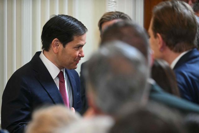 US Secretary of State Marco Rubio speaks with people before the start of an event with US President Donald Trump welcoming the 2025 NCAA Basketball champions Florida Gators to the White House in Washington, DC, on May 21, 2025. (Photo by Jim WATSON / AFP)