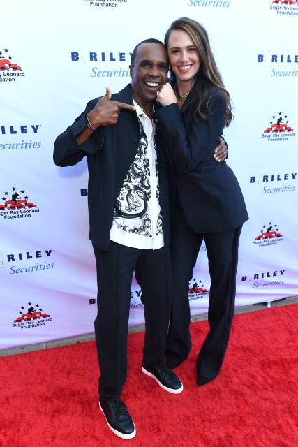 US former professional boxer Sugar Ray Leonard (L) and Clair Khodara arrive for the 14th Annual Sugar Ray Leonard Foundation ‘Big Fighters, Big Cause’ Charity Boxing Night at the The Ritz-Carlton in Marina del Rey, California, on May 21, 2025. (Photo by Unique Nicole / AFP)