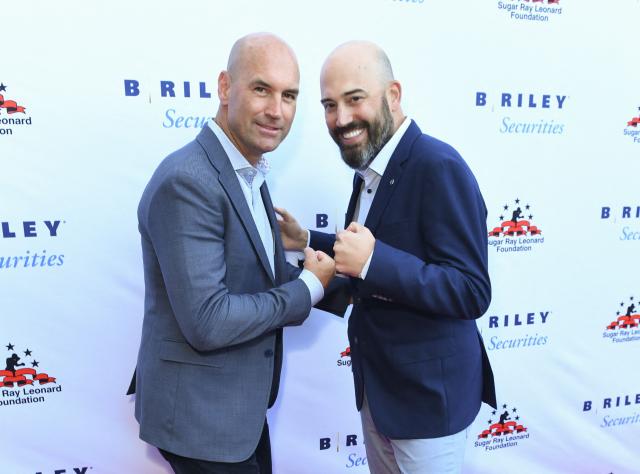 Andy Moore (R), Chairman & Co-Chief Executive Officer and Jimmy Baker (L) Co-Chief Executive Officer of  B. Riley Securities, arrive for the 14th Annual Sugar Ray Leonard Foundation ‘Big Fighters, Big Cause’ Charity Boxing Night at the The Ritz-Carlton in Marina del Rey, California, on May 21, 2025. (Photo by Unique Nicole / AFP)