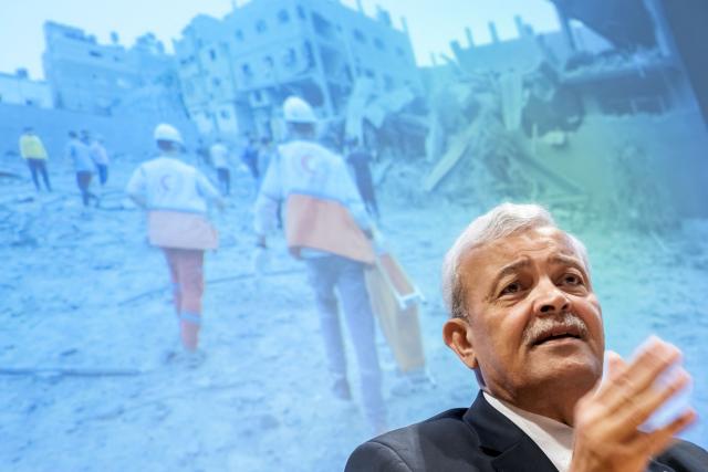 President of the Palestine Red Crescent Society (PRCS), Younis al-Khatib speaks during a press conference on the situation in the Gaza Strip, in Geneva on May 22, 2025. (Photo by FABRICE COFFRINI / AFP)