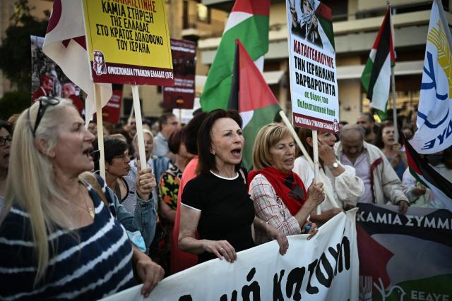 People demonstrate in support to the Palestinian people outside the Israeli embassy in Athens on May 22, 2025. (Photo by Aris MESSINIS / AFP)