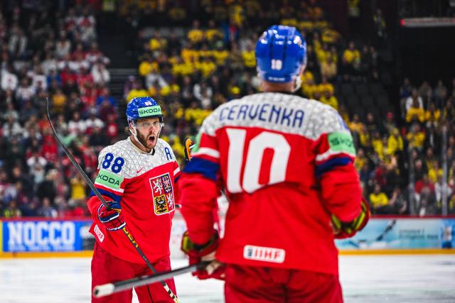 Czech’s forward #10 Roman Cervenka celebrates with Czech’s forward #88 David Pastrnak after scoring 3-1 during during the IIHF Men's Ice Hockey World Championship quarter-final match between Sweden and Czech Republic in Stockholm, on May 22, 2025. (Photo by Jonathan NACKSTRAND / AFP)