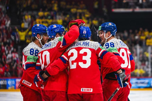 Czech’s forward #10 Roman Cervenka celebrates with his teammates after scoring 3-1 during the IIHF Men's Ice Hockey World Championship quarter-final match between Sweden and Czech Republic in Stockholm, on May 22, 2025. (Photo by Jonathan NACKSTRAND / AFP)