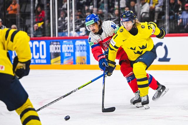 Czech Republic's forward #44 Matej Stransky and Sweden's forward #71 William Karlsson vie for the puck during the IIHF Men's Ice Hockey World Championship quarter-final match between Sweden and Czech Republic in Stockholm, on May 22, 2025. (Photo by Jonathan NACKSTRAND / AFP)
