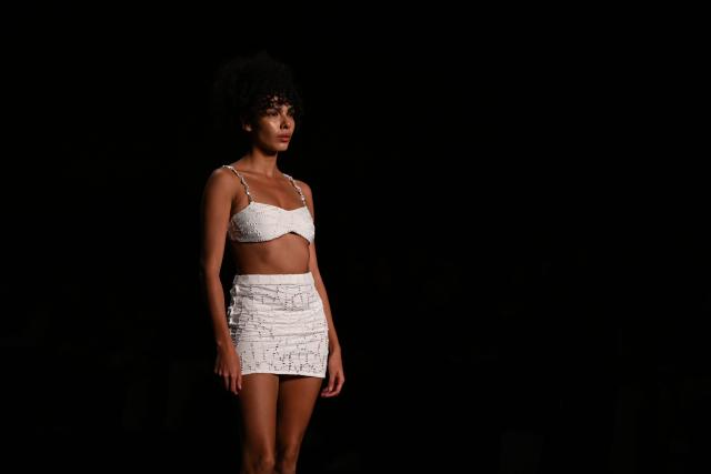 A model presents a creation by Palmacea brand during Bogota Fashion Week in Bogota on May 22, 2025. (Photo by Luis ACOSTA / AFP)