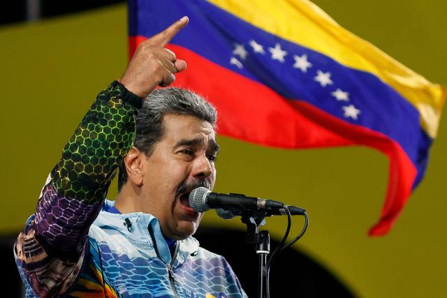 Venezuela's President Nicolas Maduro speaks to supporters during the closing campaign rally of the ruling United Socialist Party of Venezuela (PSUV) ahead of the parliamentary and regional election in Caracas on May 22, 2025. Venezuela will hold parliamentary and regional elections on May 25. (Photo by Pedro MATTEY / AFP)