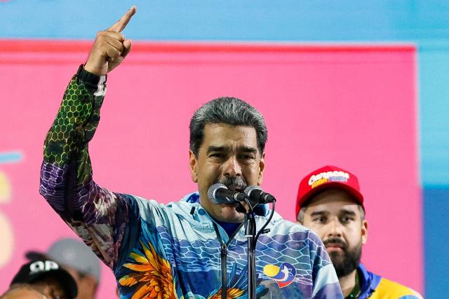Venezuela's President Nicolas Maduro speaks to supporters during the closing campaign rally of the ruling United Socialist Party of Venezuela (PSUV) ahead of the parliamentary and regional election in Caracas on May 22, 2025. Venezuela will hold parliamentary and regional elections on May 25. (Photo by Pedro MATTEY / AFP)