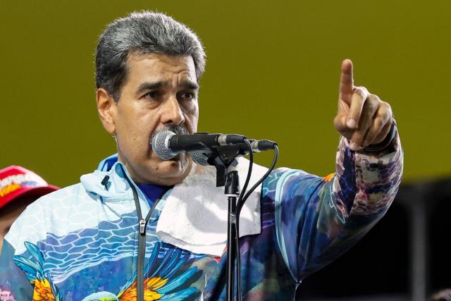 Venezuela's President Nicolas Maduro speaks to supporters during the closing campaign rally of the ruling United Socialist Party of Venezuela (PSUV) ahead of the parliamentary and regional election in Caracas on May 22, 2025. Venezuela will hold parliamentary and regional elections on May 25. (Photo by Pedro MATTEY / AFP)